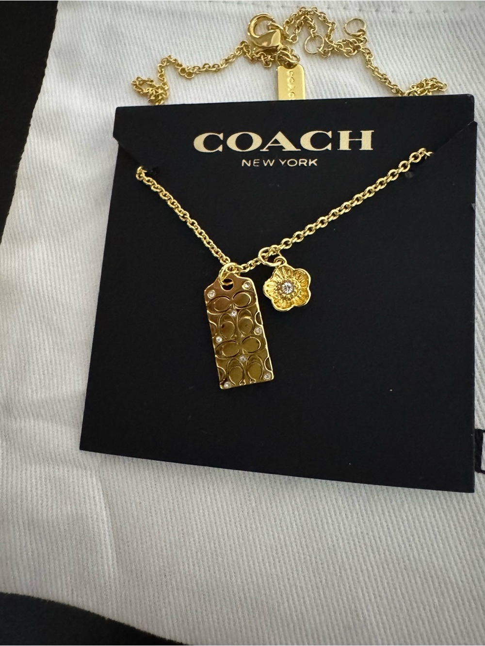 Coach Gold-Tone Logo Tag and Flower Charm Necklace